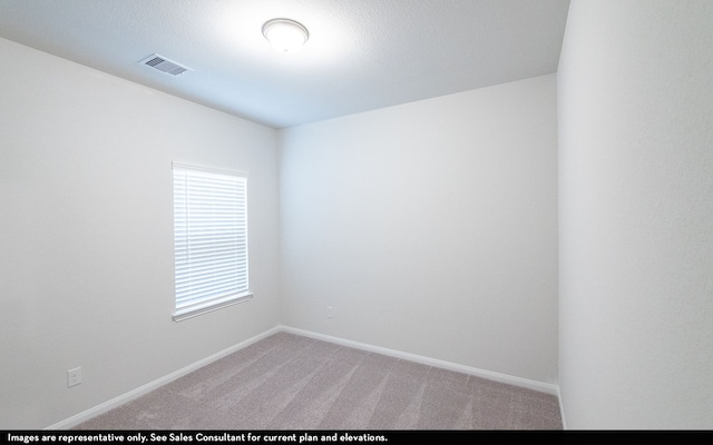 spare room with carpet flooring