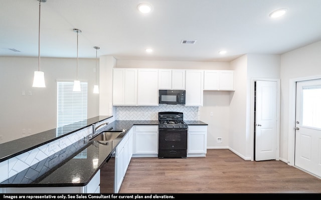 kitchen with black appliances, sink, light hardwood / wood-style flooring, and white cabinets