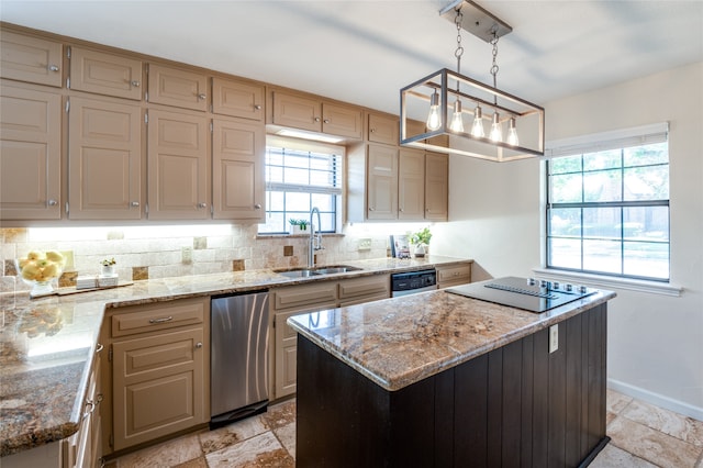 kitchen with a wealth of natural light, a center island, hanging light fixtures, and sink