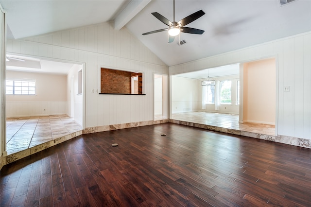 unfurnished room with hardwood / wood-style floors, lofted ceiling with beams, and a wealth of natural light