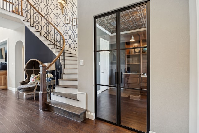 stairs with hardwood / wood-style floors