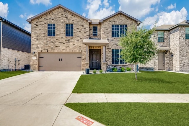 view of front of home featuring a garage and a front lawn