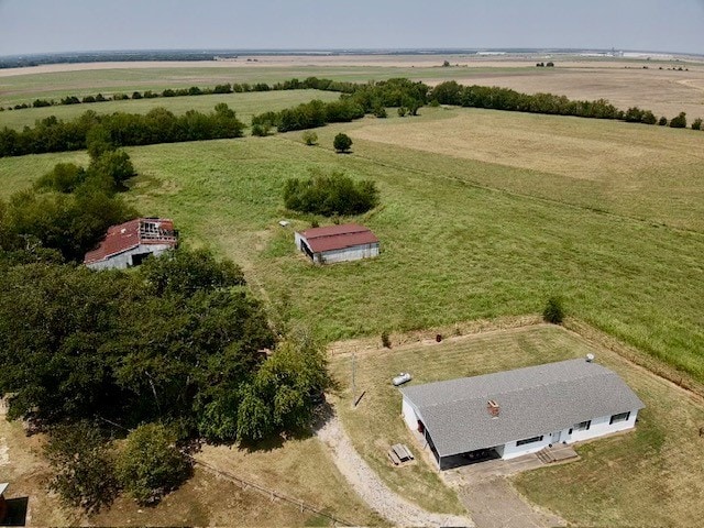 birds eye view of property with a rural view