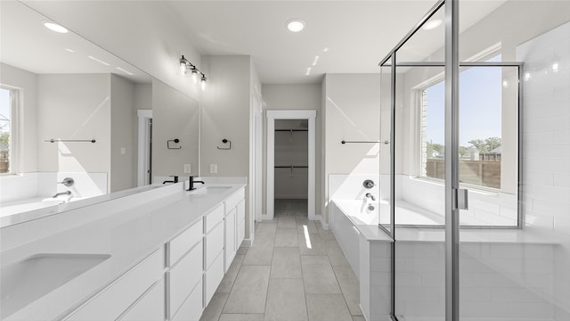 bathroom featuring vanity, tile patterned flooring, and independent shower and bath