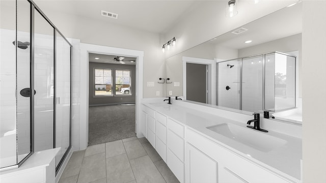 bathroom featuring ceiling fan, tile patterned floors, vanity, and an enclosed shower