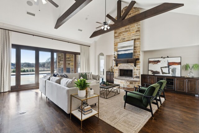 dining room with visible vents, dark wood finished floors, arched walkways, an inviting chandelier, and baseboards