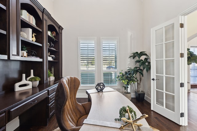 office area with dark wood-style floors and baseboards