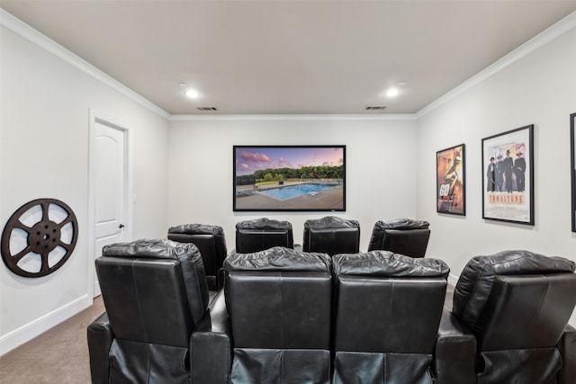 cinema room with baseboards, carpet, visible vents, and ornamental molding