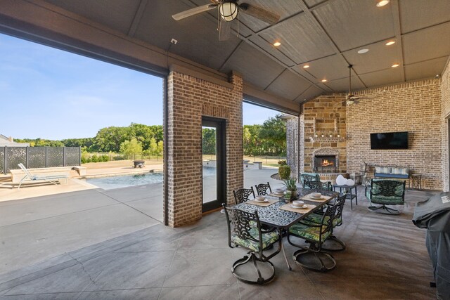 outdoor pool featuring a patio area and an outdoor fire pit