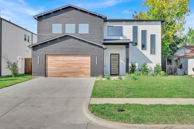 modern home with a garage and a front lawn