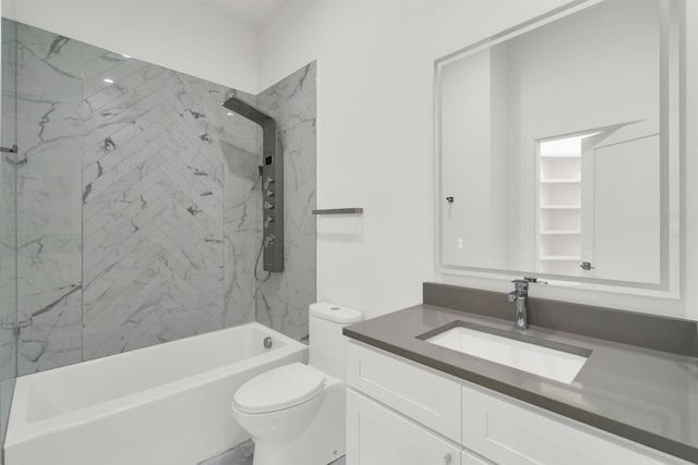 full bathroom featuring vanity, tiled shower / bath combo, and toilet