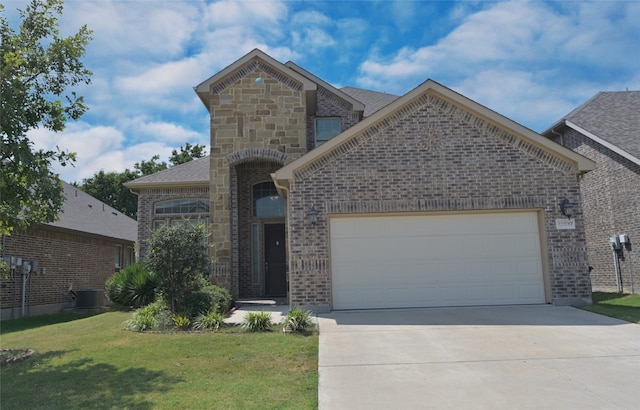 view of front of property with cooling unit, a garage, and a front yard