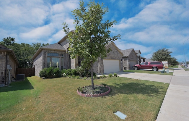 view of front facade with a garage and a front lawn