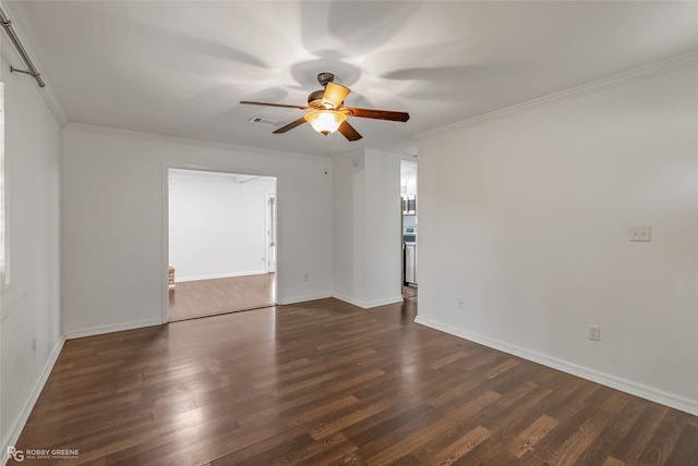 empty room with ornamental molding, ceiling fan, and dark hardwood / wood-style floors