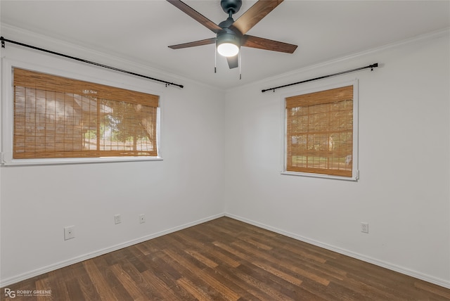 empty room with crown molding, ceiling fan, and dark hardwood / wood-style floors