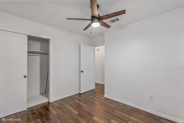 unfurnished bedroom with a closet, ceiling fan, dark hardwood / wood-style flooring, and ornamental molding