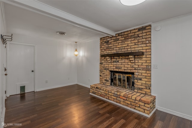 unfurnished living room with crown molding, a brick fireplace, brick wall, dark hardwood / wood-style floors, and beam ceiling