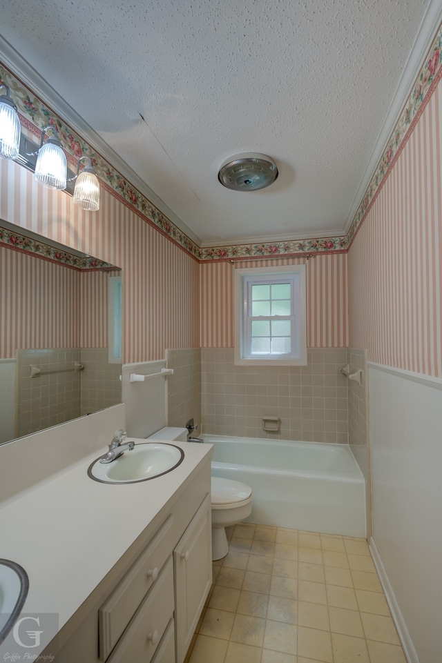 bathroom featuring vanity, a textured ceiling, toilet, and tile patterned flooring