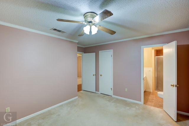 unfurnished bedroom featuring a textured ceiling, ceiling fan, ornamental molding, and light carpet