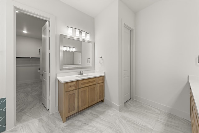 981 Stanford Ln, Prosper, TX 75078 - full bathroom featuring marble finish floor, baseboards, and vanity