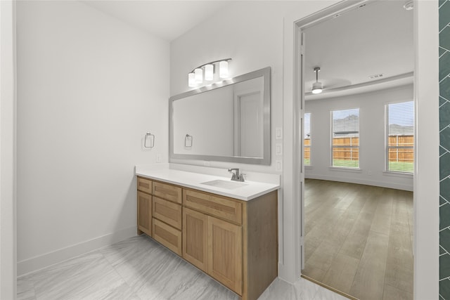981 Stanford Ln, Prosper, TX 75078 - bathroom with visible vents, baseboards, vanity, and ceiling fan