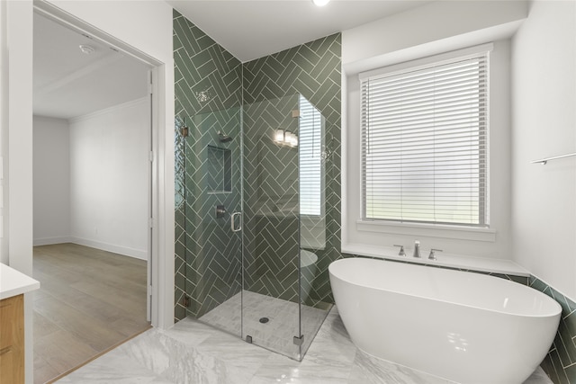 bathroom with vanity, plus walk in shower, and wood-type flooring