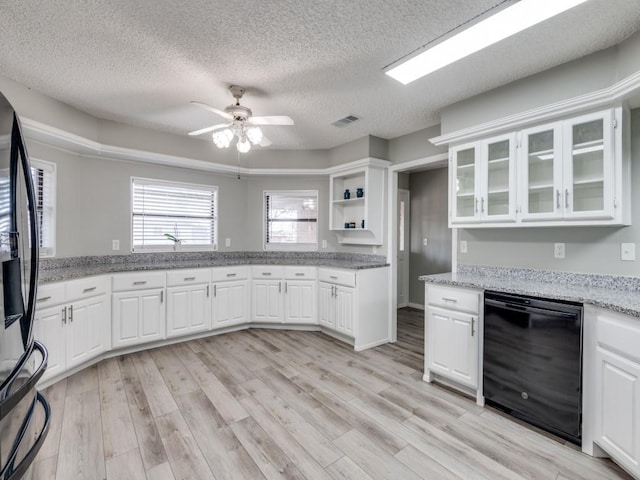 kitchen featuring visible vents, refrigerator with ice dispenser, white cabinetry, dishwasher, and light wood finished floors