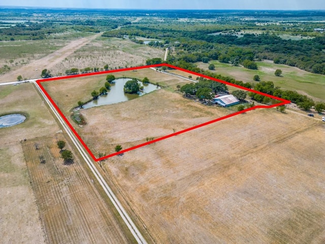 birds eye view of property featuring a rural view