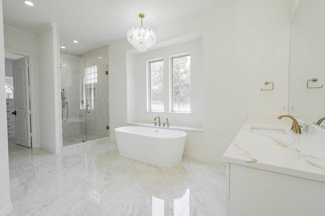 bathroom featuring crown molding, vanity, an inviting chandelier, and plus walk in shower