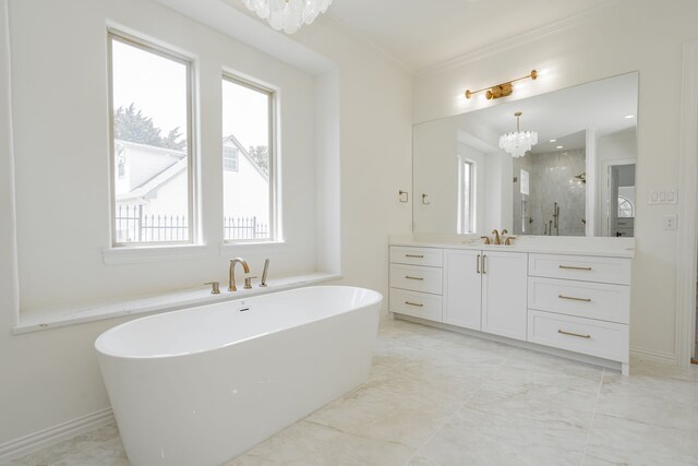 bathroom featuring vanity, plenty of natural light, an inviting chandelier, and shower with separate bathtub