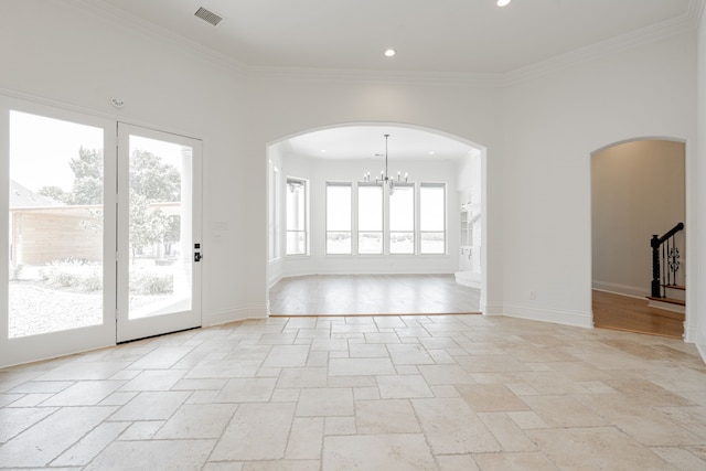 unfurnished living room with ornamental molding, a chandelier, and light hardwood / wood-style floors