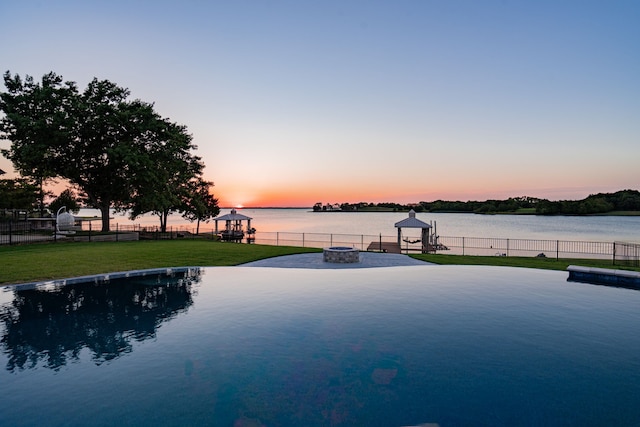 view of water feature with an outdoor fire pit