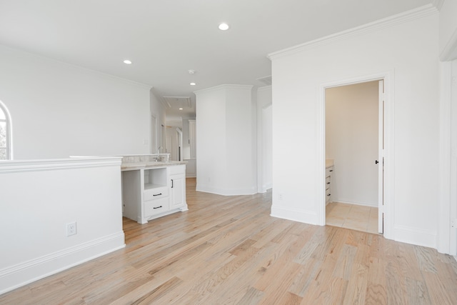 spare room with light wood-style floors, recessed lighting, crown molding, and baseboards