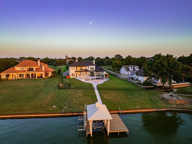 aerial view at dusk with a water view