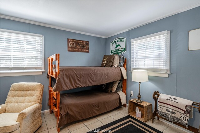 bedroom with crown molding and light tile patterned floors