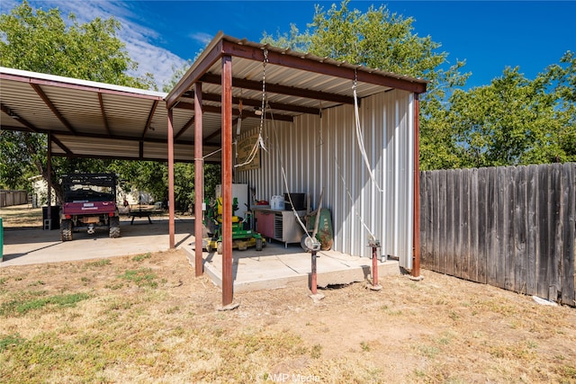 exterior space with a carport