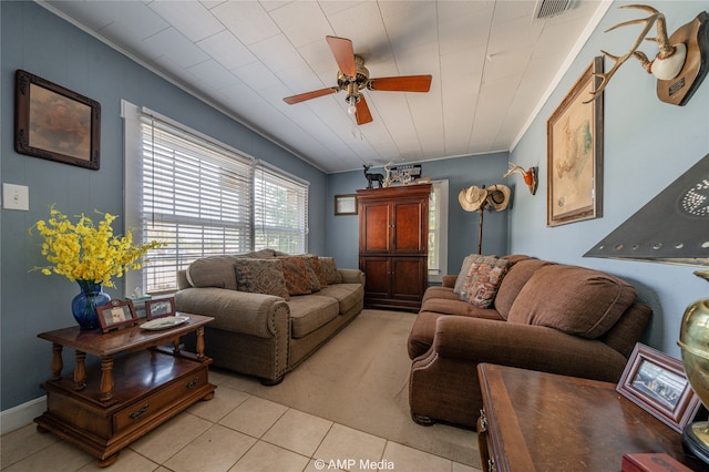 living room with ceiling fan and light tile patterned floors