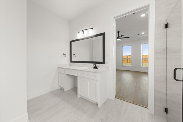 bathroom featuring ceiling fan, an enclosed shower, wood-type flooring, and vanity