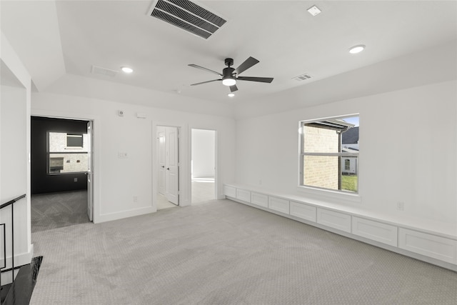 carpeted empty room with ceiling fan