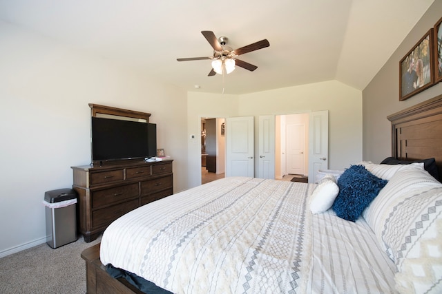 bedroom featuring lofted ceiling, ceiling fan, and light colored carpet