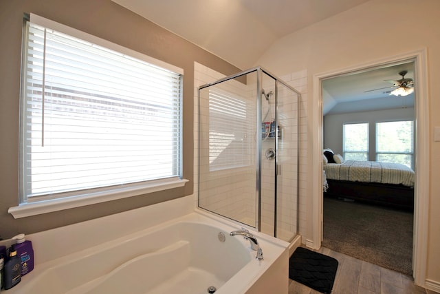 bathroom featuring lofted ceiling, ceiling fan, independent shower and bath, and wood-type flooring