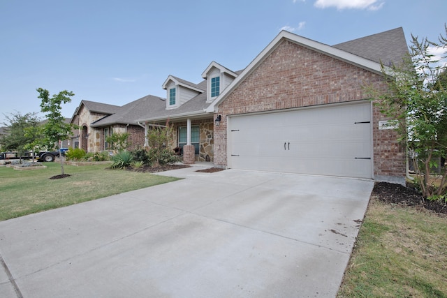 view of front of home featuring a garage and a front lawn