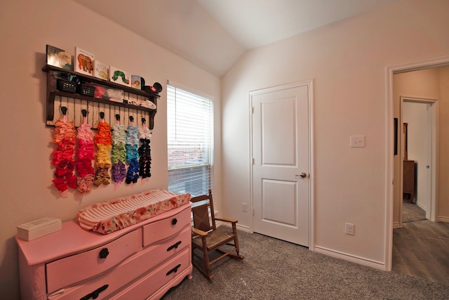 bedroom with vaulted ceiling and carpet