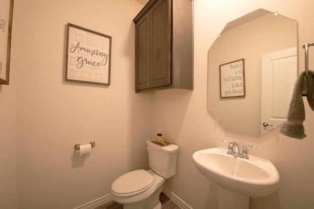 bathroom with toilet and sink