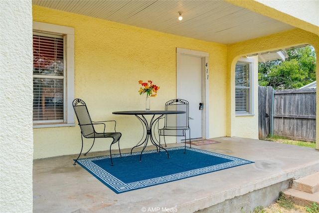 view of patio / terrace featuring fence