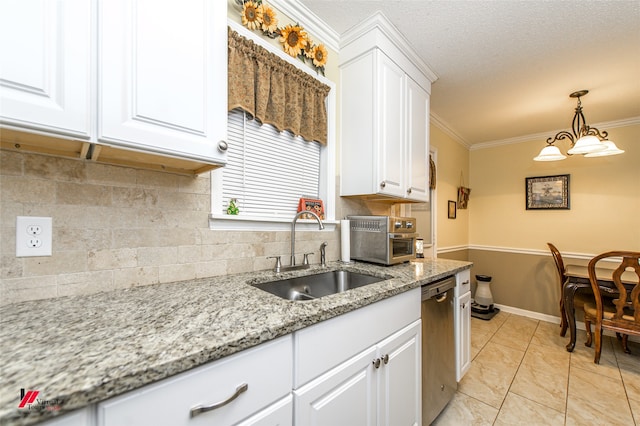 kitchen featuring white cabinetry, decorative backsplash, sink, and ornamental molding