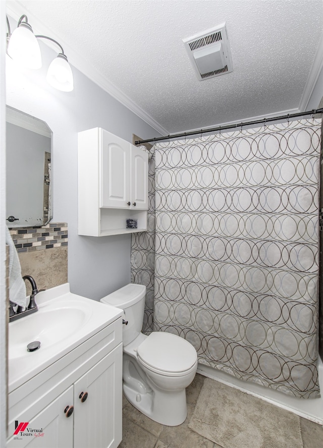 bathroom featuring toilet, tile patterned flooring, crown molding, a shower with shower curtain, and vanity