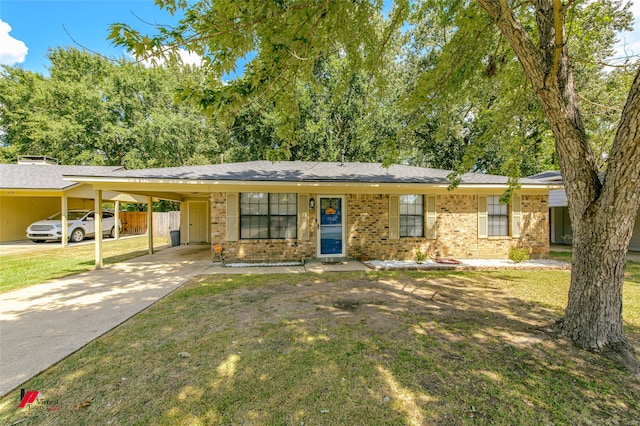 ranch-style house featuring a front yard and a carport