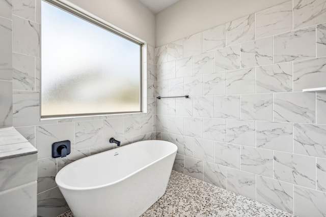 full bathroom featuring a soaking tub