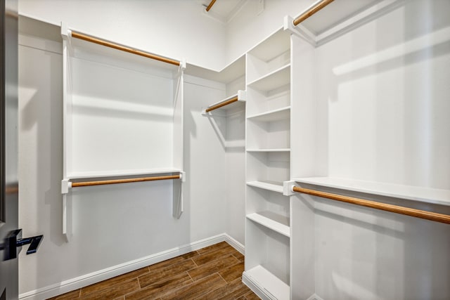 walk in closet with wood tiled floor